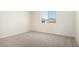 A cozy bedroom with a window offering views of the landscape and mountains at 18746 E Panchito Dr, Gold Canyon, AZ 85118