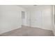 This bedroom features neutral carpet and access to the hallway and closet at 18746 E Panchito Dr, Gold Canyon, AZ 85118