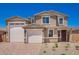 Stately two-story home with a three-car garage and nicely manicured front yard at 18746 E Panchito Dr, Gold Canyon, AZ 85118