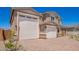 A beautifully designed home featuring a three-car garage and stunning architectural details at 18746 E Panchito Dr, Gold Canyon, AZ 85118