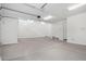 A three car garage, featuring bright lighting, offers ample parking and extra storage space at 18746 E Panchito Dr, Gold Canyon, AZ 85118