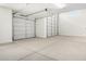 Spacious three car garage, featuring bright lighting and automatic doors, offers ample parking at 18746 E Panchito Dr, Gold Canyon, AZ 85118