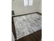 This bedroom features sleek, dark wood floors and a modern rug to add style and comfort at 1440 N Idaho Rd # 2041, Apache Junction, AZ 85119
