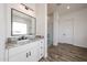 Bright bathroom features double sink vanity with a large mirror and tiled walk-in shower at 3295 W Mesquite St, Phoenix, AZ 85086