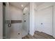 Modern bathroom with a glass enclosed walk-in shower and tiled walls, adding a touch of luxury at 3295 W Mesquite St, Phoenix, AZ 85086