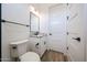 Clean bathroom featuring granite countertop vanity, black hardware, and bright lighting at 3295 W Mesquite St, Phoenix, AZ 85086