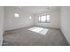 Bedroom with neutral carpet, bright light, and contemporary square windows at 3295 W Mesquite St, Phoenix, AZ 85086