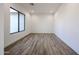 Bedroom featuring tile floors, a large window, and neutral paint at 3295 W Mesquite St, Phoenix, AZ 85086