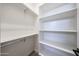 Functional closet with multiple shelves and closet rods for optimal storage at 3295 W Mesquite St, Phoenix, AZ 85086