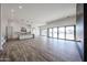 Open-concept living room with lots of natural light and kitchen view at 3295 W Mesquite St, Phoenix, AZ 85086