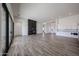 Stylish living room with a modern fireplace, wood-look flooring, and views to the outside at 3295 W Mesquite St, Phoenix, AZ 85086