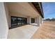 Covered patio featuring sliding glass doors and a concrete floor, perfect for outdoor living at 3295 W Mesquite St, Phoenix, AZ 85086