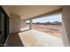 Covered patio with concrete flooring and open views of the expansive surrounding landscape at 3295 W Mesquite St, Phoenix, AZ 85086