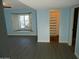 Bedroom with wood-look floors, window shutters and a large closet at 13218 W Castlebar Dr, Sun City West, AZ 85375