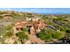 A stunning aerial view shows the layout of the expansive estate and surrounding desert landscape at 42383 N 111Th Pl, Scottsdale, AZ 85262