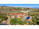 View of luxury desert home and community with red tile roofs, desert landscaping and mountain views at 42383 N 111Th Pl, Scottsdale, AZ 85262