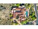 Expansive aerial view showcasing a luxurious home with a pool, tiled roof, and beautiful landscaping at 42383 N 111Th Pl, Scottsdale, AZ 85262