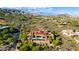 Aerial view of a luxury home in a desert community, featuring a pool and expansive mountain views at 42383 N 111Th Pl, Scottsdale, AZ 85262