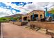 Stunning outdoor living area with a pool, travertine pavers and desert mountain views at 42383 N 111Th Pl, Scottsdale, AZ 85262