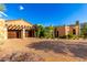 Spacious garage and desert landscaping create a tranquil setting for this home at 42383 N 111Th Pl, Scottsdale, AZ 85262