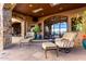 Relaxing patio offers comfortable seating and views through large windows, seamlessly blending indoor and outdoor living at 42383 N 111Th Pl, Scottsdale, AZ 85262