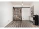 Bedroom features vinyl floors and a rustic sliding barn door at 520 S Brett St, Gilbert, AZ 85296