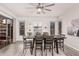 Stylish dining room featuring custom built-ins, sleek flooring, and sliding glass doors for natural light at 520 S Brett St, Gilbert, AZ 85296