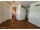 Entryway with hardwood floors and access to kitchen at 9744 N 97Th Ln, Peoria, AZ 85345