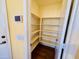 Walk-in pantry with built-in shelving at 9744 N 97Th Ln, Peoria, AZ 85345