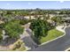 Stunning aerial view of a home with lush landscaping, a circular driveway, and a picturesque mountain backdrop at 2222 N Val Vista Dr # 3, Mesa, AZ 85213