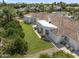 Aerial view of a sprawling single-story home, showcasing the tile roof, expansive lawn, and mature landscaping at 2222 N Val Vista Dr # 3, Mesa, AZ 85213