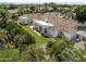 Spacious home with a covered patio, lush backyard, mature trees, and a tile roof, as seen from above at 2222 N Val Vista Dr # 3, Mesa, AZ 85213