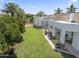 Backyard aerial view showcasing a lush lawn, mature landscaping, and a spacious patio area at 2222 N Val Vista Dr # 3, Mesa, AZ 85213