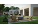 Serene backyard with a fire pit, stylish seating, and a glimpse of the modern home design at 2222 N Val Vista Dr # 3, Mesa, AZ 85213