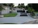 Spacious driveway with gated entry, showcasing a modern home and lush landscaping at 2222 N Val Vista Dr # 3, Mesa, AZ 85213