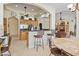 Open kitchen with stainless steel appliances, breakfast bar seating, and adjacent dining area at 2222 N Val Vista Dr # 3, Mesa, AZ 85213