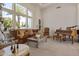 Cozy living room featuring large windows, comfortable seating, and a grand piano for musical enjoyment at 2222 N Val Vista Dr # 3, Mesa, AZ 85213