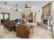 Inviting living room featuring a stone fireplace, comfortable leather seating, and custom built-in features at 2222 N Val Vista Dr # 3, Mesa, AZ 85213