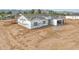 Aerial view of a new single-story home under construction with a two-car garage at 4550 N 192Nd Dr, Litchfield Park, AZ 85340