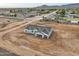 Aerial view of a new single-story home under construction with a two-car garage at 4550 N 192Nd Dr, Litchfield Park, AZ 85340