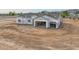 Aerial view of a new single-story home under construction with a two-car garage at 4550 N 192Nd Dr, Litchfield Park, AZ 85340