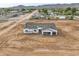 Aerial view of a new single-story home under construction with a two-car garage at 4550 N 192Nd Dr, Litchfield Park, AZ 85340