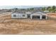 Aerial view of a new single-story home under construction with a two-car garage at 4550 N 192Nd Dr, Litchfield Park, AZ 85340