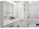 Elegant bathroom showcases a modern vanity with ample storage space and white counters at 13653 E Aloe Vera Dr, Scottsdale, AZ 85262
