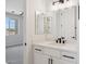 Stylish bathroom with double mirrors, black hardware, and a view to the bedroom at 13653 E Aloe Vera Dr, Scottsdale, AZ 85262