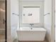 Bright bathroom with free standing tub, modern fixtures and finishes and window at 13653 E Aloe Vera Dr, Scottsdale, AZ 85262