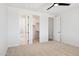Spacious bedroom features neutral walls and carpeting with multiple closet and bathroom access at 13653 E Aloe Vera Dr, Scottsdale, AZ 85262