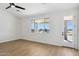 Bright, spacious bedroom with a walk-out door, wood-look floors and a large window at 13653 E Aloe Vera Dr, Scottsdale, AZ 85262