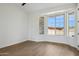 Bright bedroom with hard wood floors, modern fan and views of the desert landscape at 13653 E Aloe Vera Dr, Scottsdale, AZ 85262