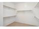 Walk-in closet with carpet and wooden shelving and clothing rods at 13653 E Aloe Vera Dr, Scottsdale, AZ 85262